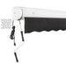 Black Awntech Key West full cassette awning retracted into its closed white cassette, with motor cord and rocker arm
