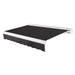 Awntech Key West full cassette motorized retractable awning in Black acrylic fabric, extended, three-quarter view with white full cassette housing and wave valance