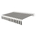 Awntech Key West full cassette motorized retractable awning in Black/White Stripe acrylic fabric, extended, three-quarter view with white full cassette housing and wave valance