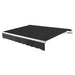 Awntech Maui motorized retractable awning in Black acrylic fabric, extended, three-quarter view with white open-roll frame and wave valance