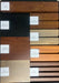 Firefly cladding sample board showing Oak, Gray, Pine, Espresso and Charcoal colors in the Click 40 and Universal panel profiles