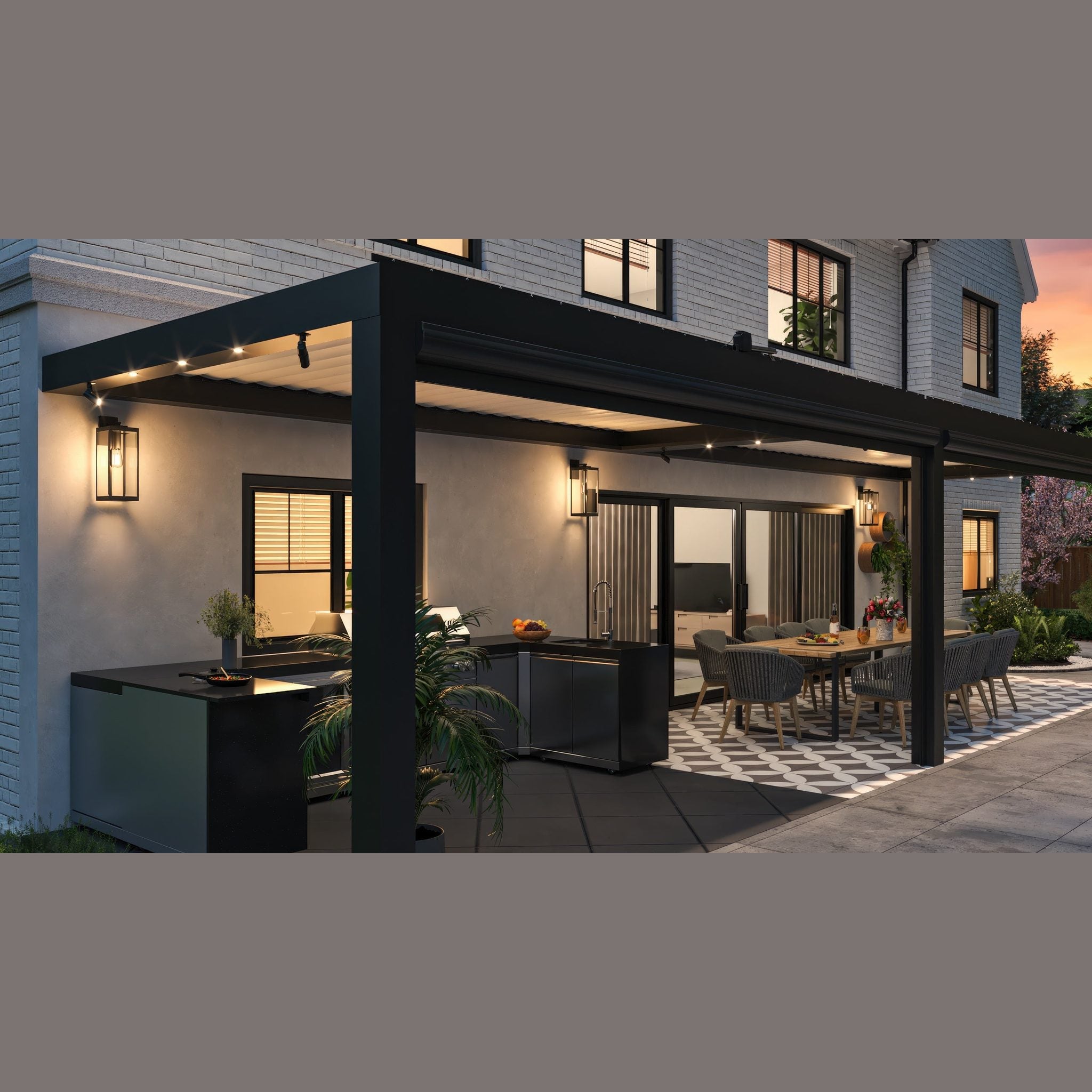 Equinox pergola at night with integrated LED downlights illuminating an outdoor kitchen and dining area