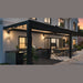 Equinox pergola at night with integrated LED downlights illuminating an outdoor kitchen and dining area
