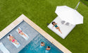 Ledge Lounger Ultra cantilever umbrella shading a pool ledge and loungers