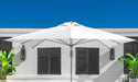 Ledge Lounger Essential pool umbrella shown in an outdoor setting, lifestyle photo 6 of 7