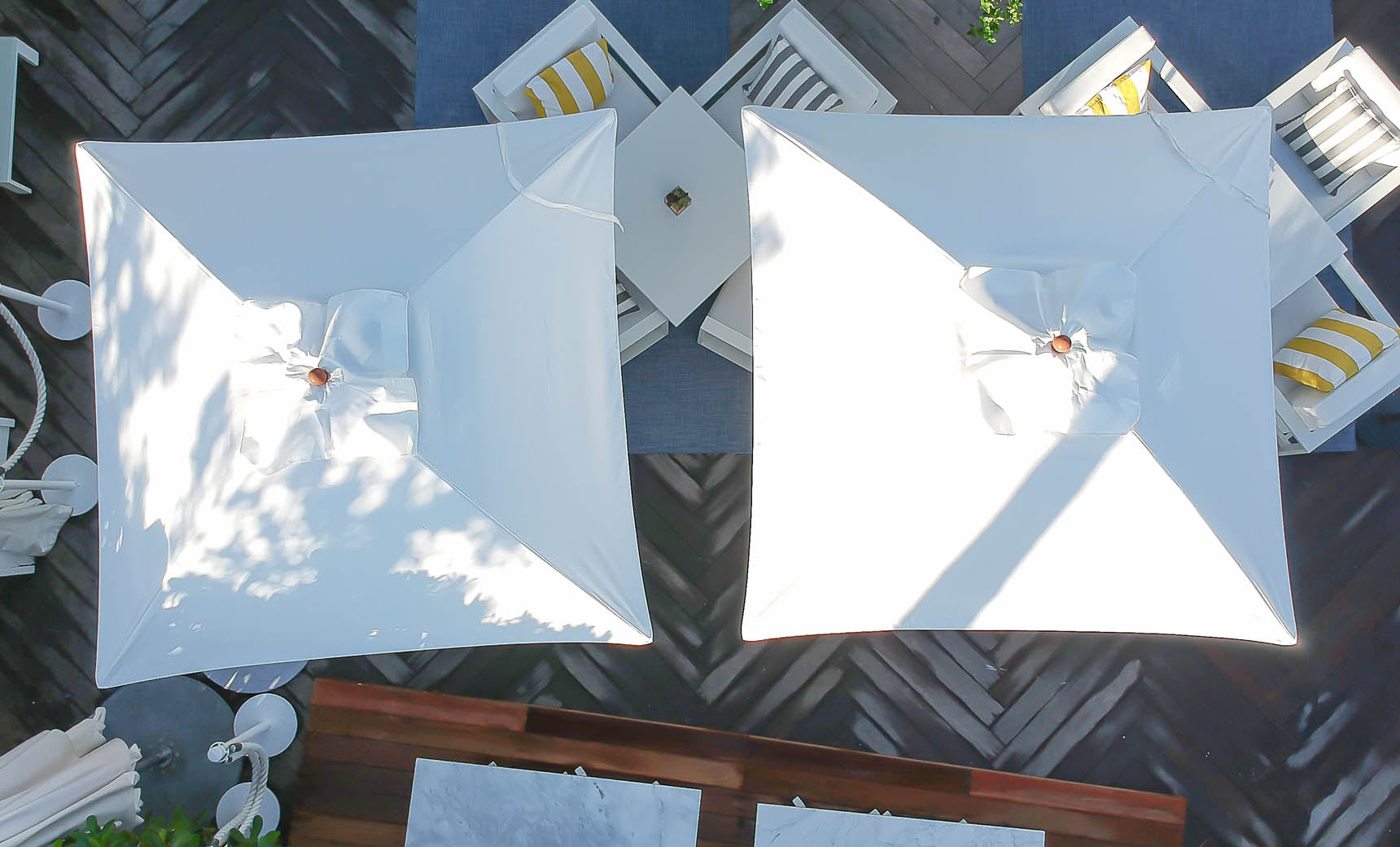 Ledge Lounger Essential pool umbrella shown in an outdoor setting, lifestyle photo 6 of 7