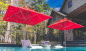 Ledge Lounger Premier pool umbrella shown in an outdoor setting, lifestyle photo 1 of 4