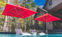 Ledge Lounger Premier pool umbrella shown in an outdoor setting, lifestyle photo 3 of 4