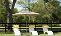 Ledge Lounger Premier pool umbrella shown in an outdoor setting, lifestyle photo 2 of 4