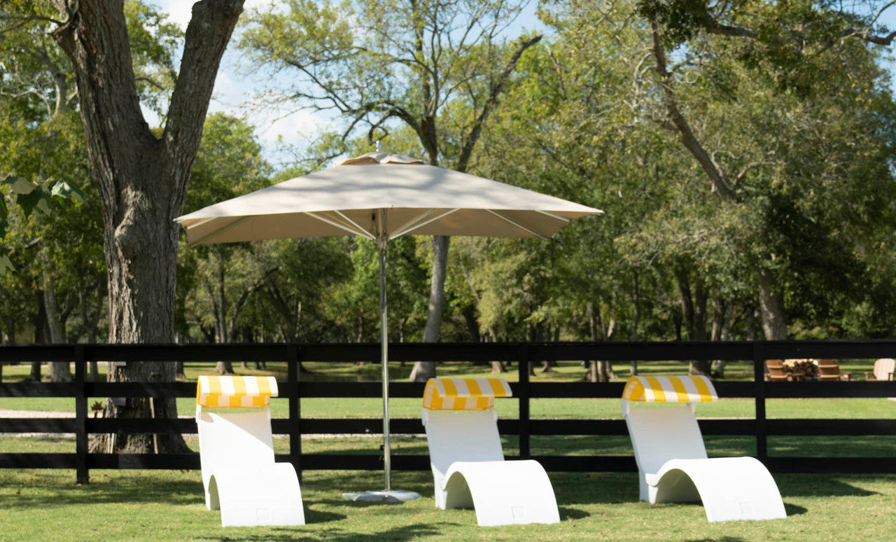 Ledge Lounger Premier pool umbrella shown in an outdoor setting, lifestyle photo 2 of 4