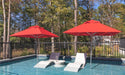 Ledge Lounger Premier pool umbrella shown in an outdoor setting, lifestyle photo 3 of 4
