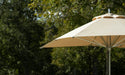 Ledge Lounger Premier pool umbrella shown in an outdoor setting, lifestyle photo 4 of 4