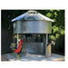 Sioux Steel grain bin gazebo on concrete base with rustic rooster decor — a charming backyard structure for STR properties